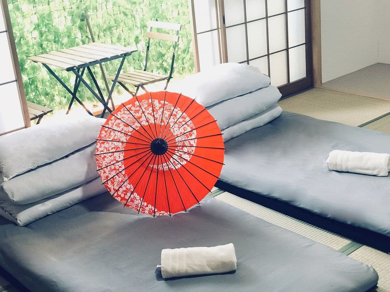 Japanese bedroom with futon beds on tatami mats.